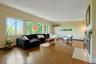 Both deep and wide, the living room has space for so much seating, and countless design opportunities. The wood floors glow under the natural light.