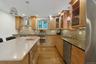 Two Jenn-Air ovens, a Miele induction stove top, Viking microwave and beautiful tile backsplash make working here easy, and fun.