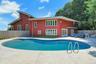 The large back patio around the pool has many seating areas. Whether you are relaxing on your own or bringing everyone over for a party, this is the s