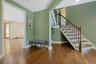 Back downstairs, the  foyer is a lovely entrance to the home.  Off screen to the left is a convenient hall closet.