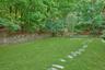 This stone path leads from the front of the home back to the pool.