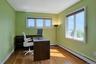 The long office has great views of the river. This flexible space, with a large closet o the far wall,  could also be used as a bedroom.