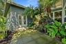 French doors lead from the downstairs primary suite out to the rear garden area