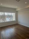 This is the huge, Master Bedroom Suite, featuring sumptuous hardwood flooring and large picture window with a scenic view of the bay and Long Island S