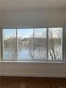 Master Bedroom Ensuite with huge picture window with view of Mill Pond and the Long Island Sound! 2 large closets (1 walk-in) and beautiful hardwood f