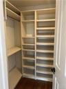 Master Bedroom walk-in closet with lots of organized shelving.