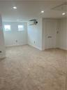 Walk up to the 4th Floor with heat and air conditioning! Huge finished 4th floor, featuring wall to wall carpeting, closets, pull down stairs above w/