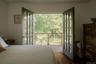 First floor primary bedroom opens to private deck