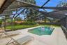 Beautiful pool and view of large private backyard