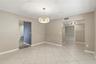Dining room with view into kitchen and office/flex space