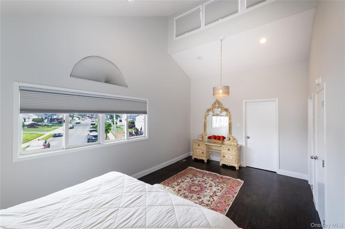 Master Bedroom Room featuring a vaulted ceiling with recessed lighting and clerestory windows