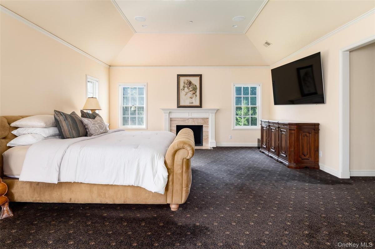 Luxurious Primary Bedroom with fireplace