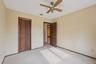 Unfurnished bedroom with a closet, a ceiling fan, and carpet flooring