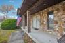 Property entrance featuring stone siding