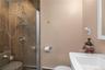 Full bath featuring a sink and a stall shower