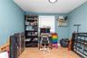 Home office with light wood finished floors and baseboards