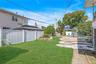 View of yard featuring a playground and a patio