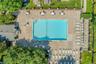 Center of community boasts large swimming pool supervised by lifeguard