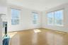 Soaring ceilings in Formal Living room, sparkling wood floors, DOUBLE SIDED GAS FIREPLACE
