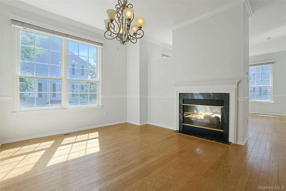 Double sided fireplace in Formal Dining Room and Formal Living Room