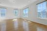 Bright Living Room with walls of glass for streaming daylight