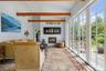 Private sitting room with French doors open to the stone courtyard
