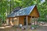 Traditional sugar shack nestled among the woodlands, supporting maple syrup production