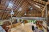 Vaulted ceilings, original timber framing and dramatic scale showcase the barn’s remarkable architectural character