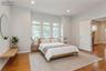 Hardwood flooring throughout the main 1st floor bedroom (virtually staged)