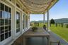 A Stunning West-Facing Front Porch is the Perfect Place to Enjoy Meals or Drinks to Watch the Sun Set.