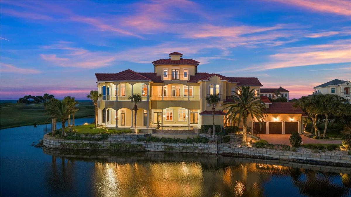 Located behind the exclusive North Gate of Hammock Dunes, this extraordinary Mediterranean estateoccupies one of the community’s most iconic peninsula