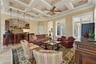 A spacious family room, dedicated wet bar, and dual wine refrigeration create aninviting gathering space.