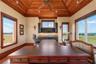 Office views, handcrafted wood ceilings, and a built-in wet bar—suddenly answering emails doesn't seem so bad.