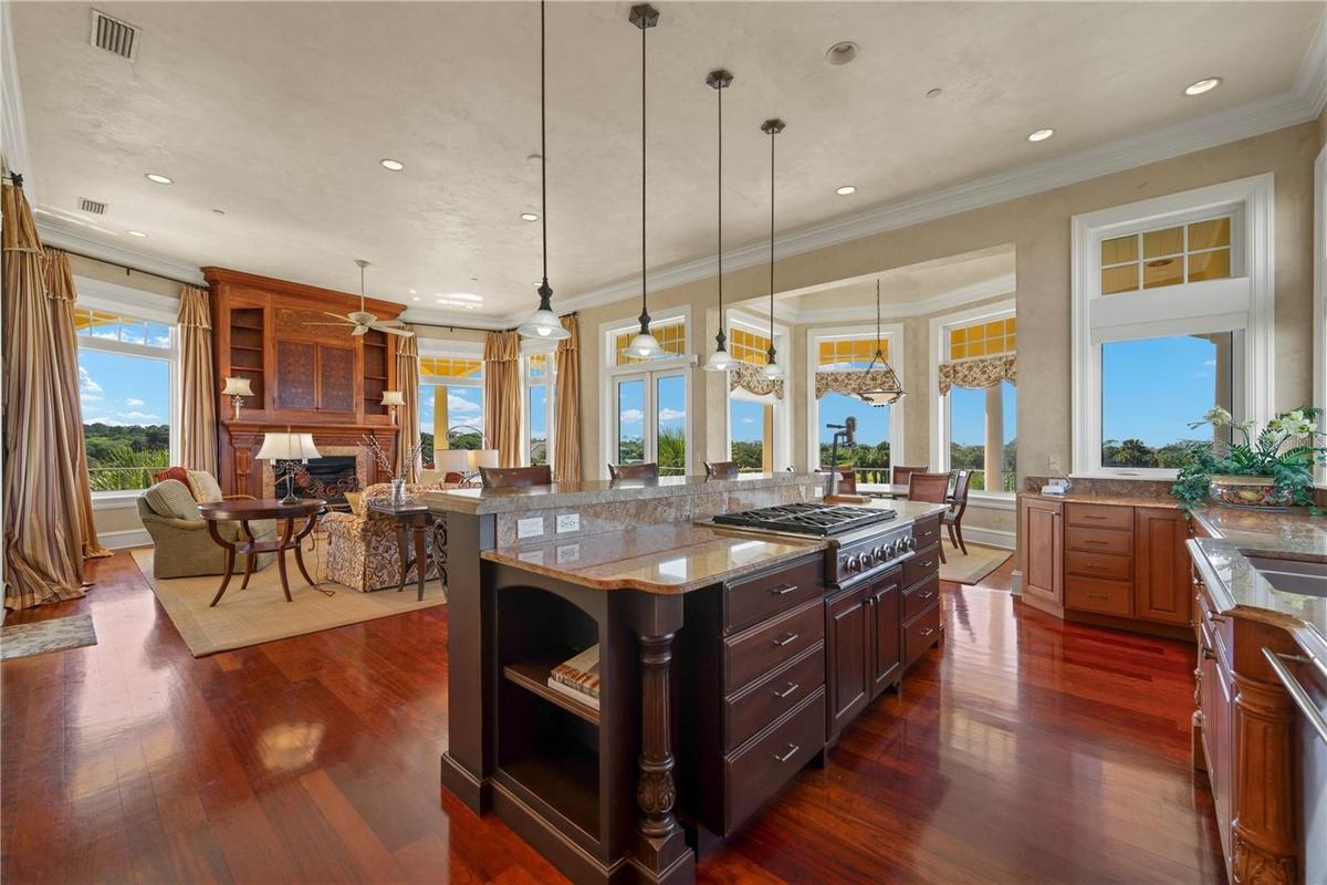 Centered around a statement island, this beautifully designed kitchen keeps the cook connected to every conversation, every meal, and every memorable 