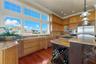 Custom cabinetry, expansive countertops, and thoughtful details create a kitchen that is as practical as it is beautiful.