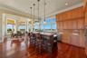 Whether preparing a gourmet meal or enjoying a quiet breakfast, every glance beyond the windows reveals a landscape worthy of the occasion.