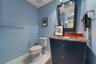A full bath just off the theater means no one has to miss the best scene—or hit pause on movie night.