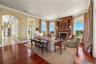 A showcase of exceptional craftsmanship, the great room is highlighted by a custom mantel crafted from black walnut and Italian Carpathian elm, while 