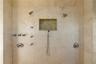 Designed for indulgence, this expansive shower features dual shower systems, body jets