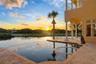 Located behind the exclusive North Gate of Hammock Dunes, this extraordinary Mediterranean estateoccupies one of the community’s most iconic peninsula