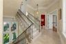 More than a staircase, this graceful architectural feature serves as the home's spine, seamlessly linking each floor while making every arrival feel s