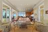 The seamless flow between the living room, kitchen and breakfast nook creates an effortless setting for everyday living and entertaining, with easy ac