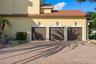 A three-car garage provide plenty of room for vehicles, golf carts, and guests, blending everyday convenience with the scale expected of a luxury esta