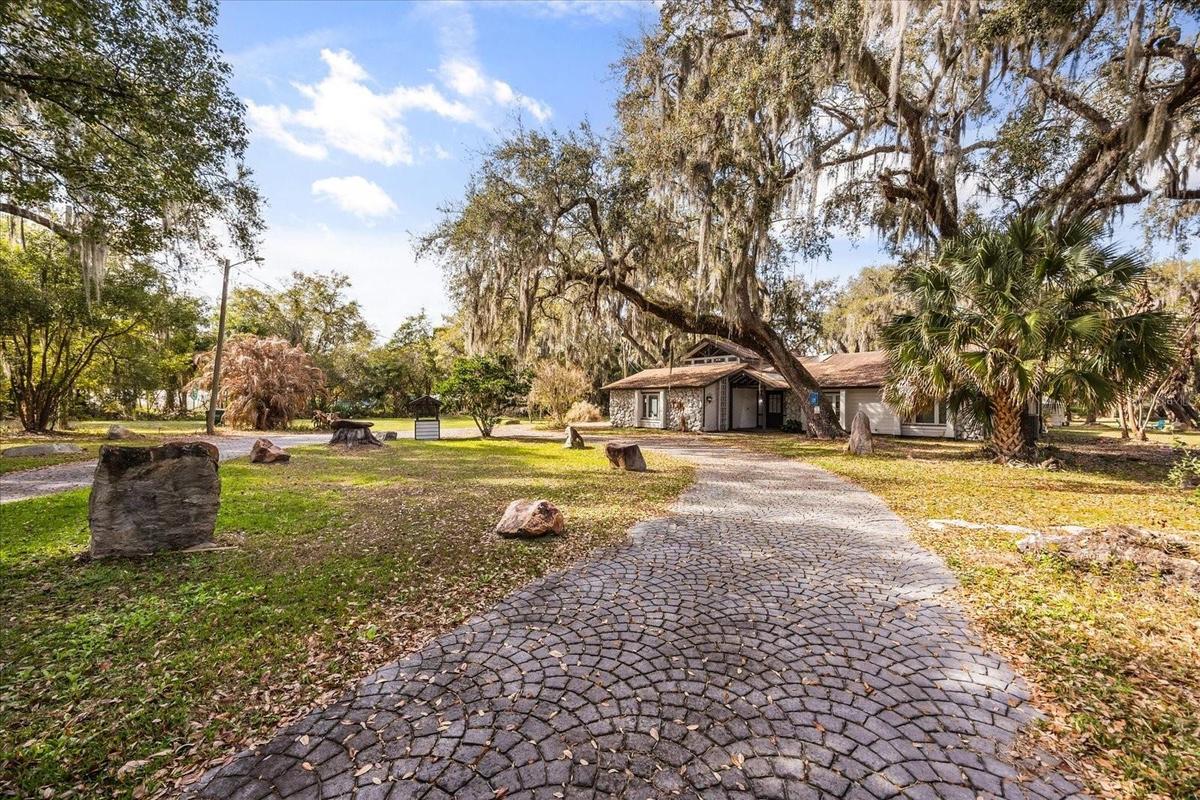 long brick-paved driveway