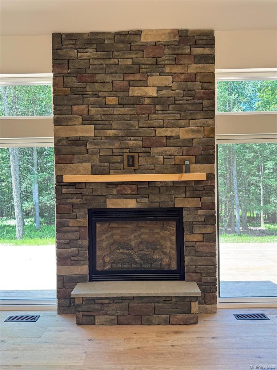 Beautiful stone work! It's the heart of the living area, easy start LP gas fireplace!