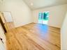 Primary bedroom has a sliding glass door which opens to the deck