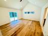 Spacious primary bedroom includes a large closet and attached full bath.