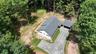 Showing home and garage from above
