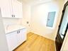 Doing laundry will be a pleasure here with so much light and those beautiful quartz counters!