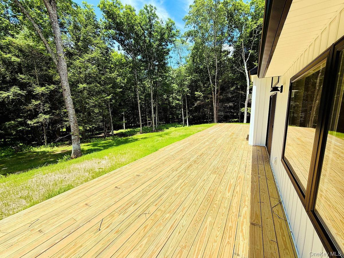 Sliding doors from LR open to this 52 foot long deck, which runs the length of the house.